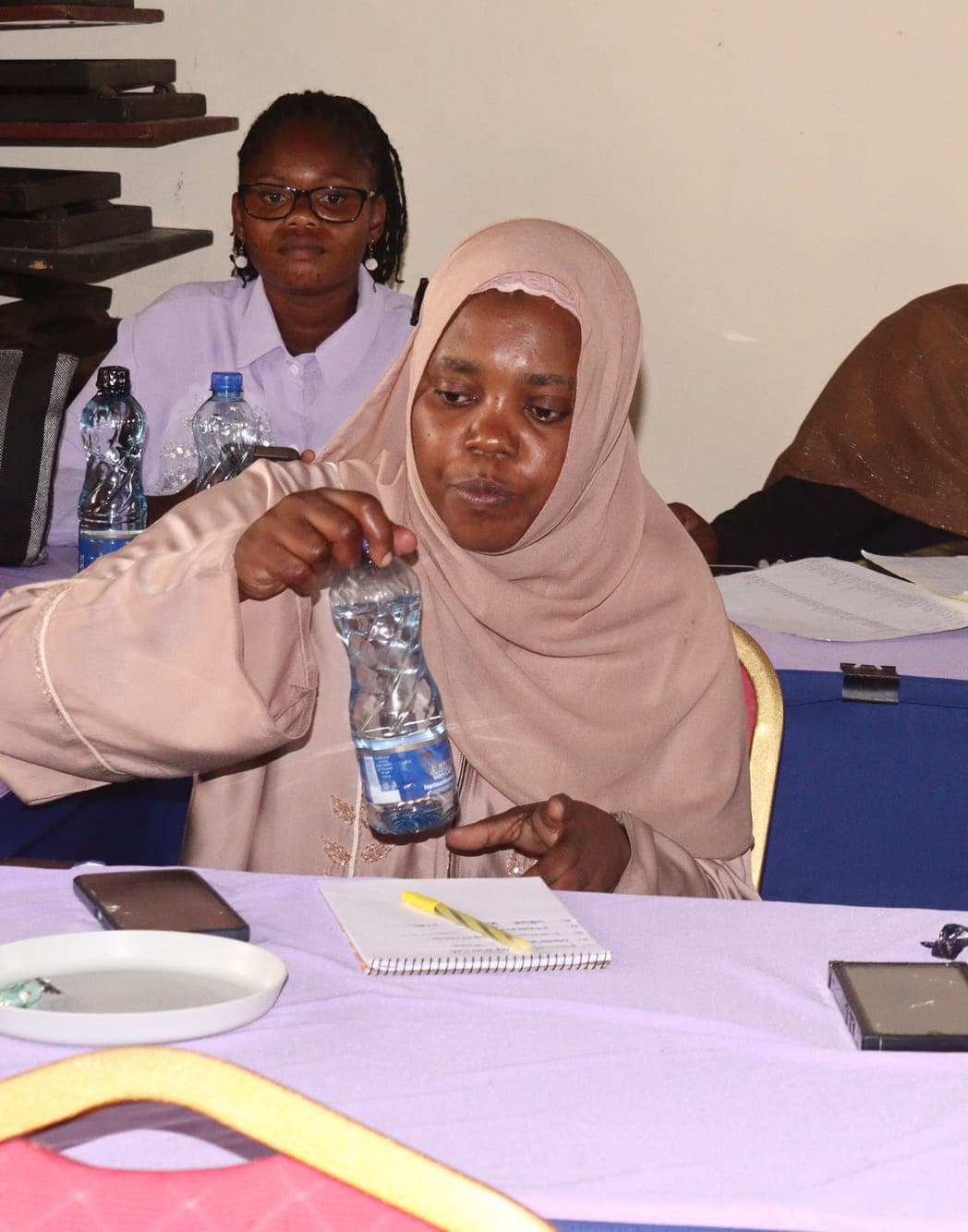 Madam Kijoli and Madam Dorcas at a GGI catch-up meeting